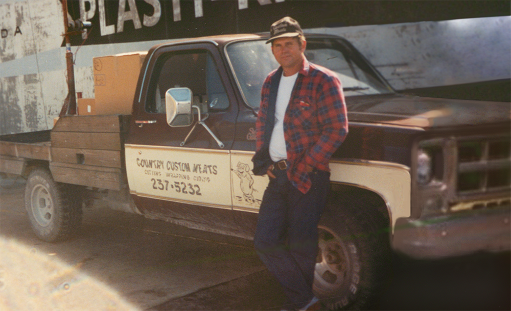 Jerry Geatches in front of his first business truck. This is part of the history of Country Meats.