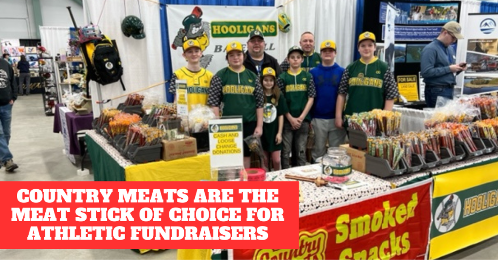 A baseball coach and players during their Country Meats fundraiser for athletes
