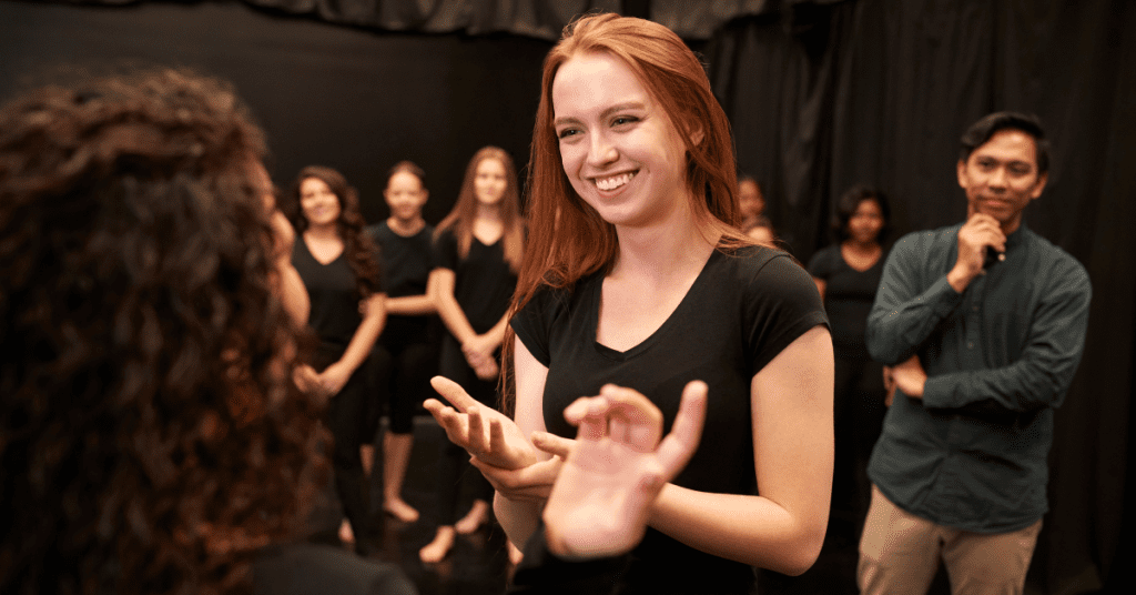 young actress with a smile on her face as they prepare for  theater group fundraising